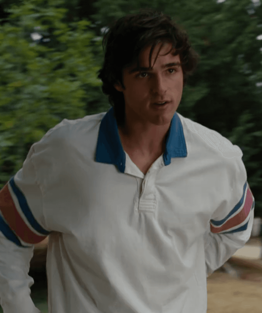 Felix is captured in a relaxed outdoor moment, sporting a vintage-inspired rugby polo that effortlessly blends collegiate charm with casual comfort, perfect for an unhurried day.